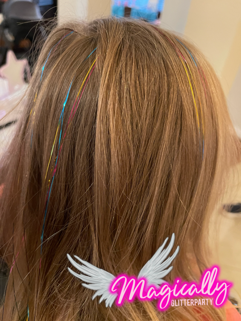 Hair Tinsel strands adding a sparkling, colorful touch to hair, perfect for events and festive celebrations.