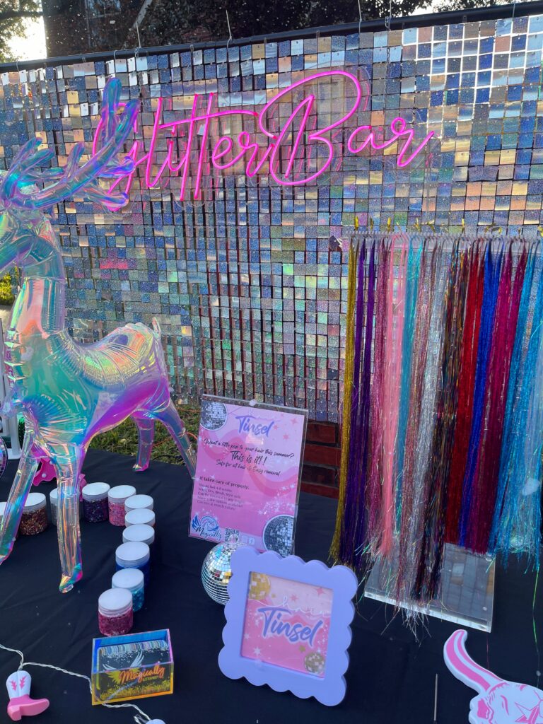 Hair Tinsel stand displaying a variety of colorful strands for adding sparkle and shine to hair at events and parties.