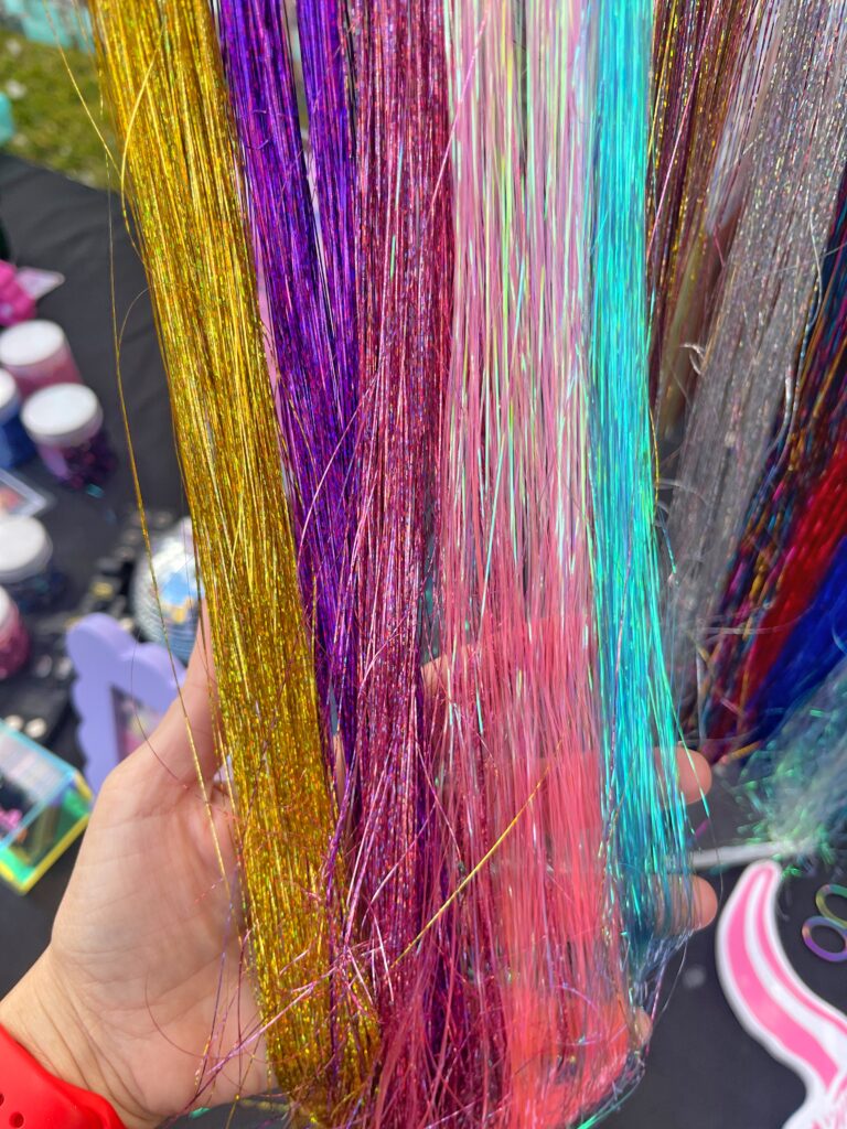 Hair Tinsel strands adding a sparkling, colorful touch to hair, perfect for events and festive celebrations.