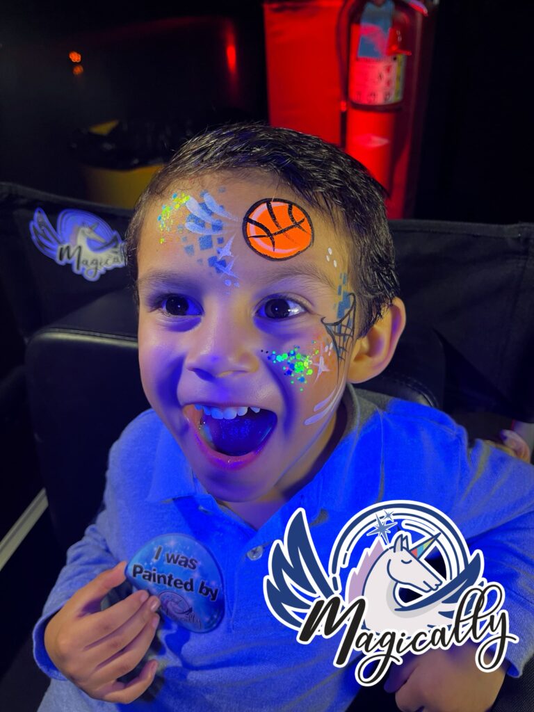 Happy boy with glowing UV neon face paint, illuminated in the dark for a vibrant and exciting effect