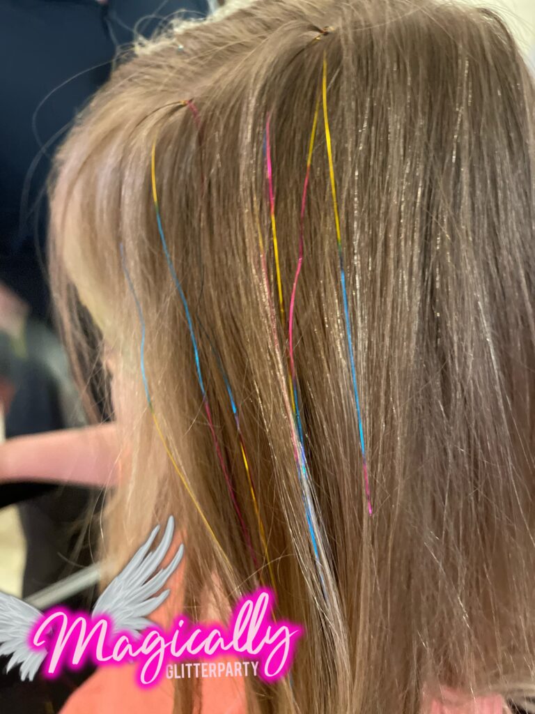 Hair Tinsel strands adding a sparkling, colorful touch to hair, perfect for events and festive celebrations.